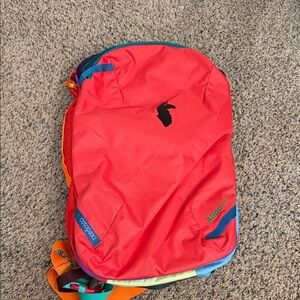 Cotopaxi Red Backpack with Blue Accents